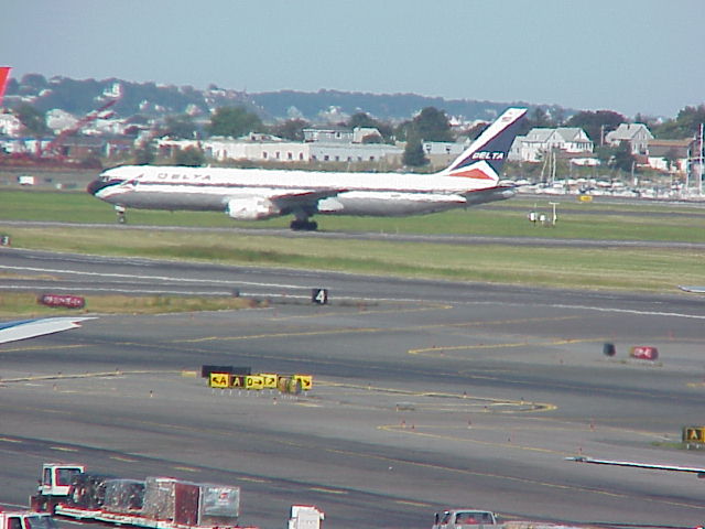 A Delta jet on a runway at Boston Logan International Airport