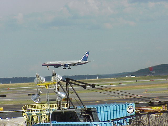 A United Airlines jet landing at Boston Logan International Airport