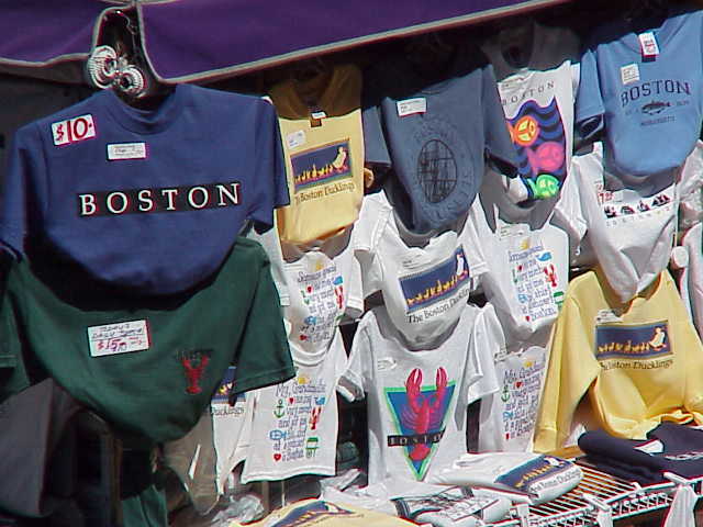 Shirts for sale on a pushcart at Quincy Market in Boston