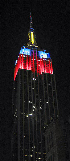 Colors light up the top of the Empire State Building at night
