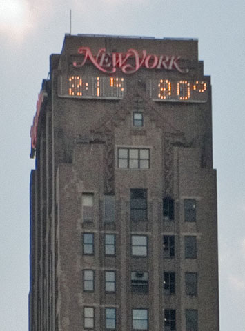 Time and temperature display at the top of a building